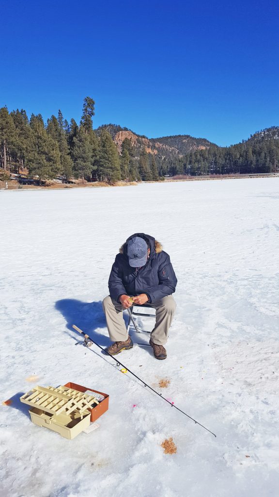 Father ice fishing